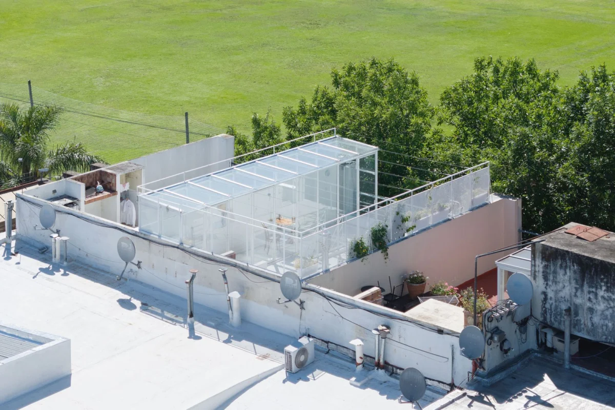 A Rooftop Glass Box Crowns a Reimagined Factory Home in Buenos Aires, Setting a New Standard for Adaptive Reuse.