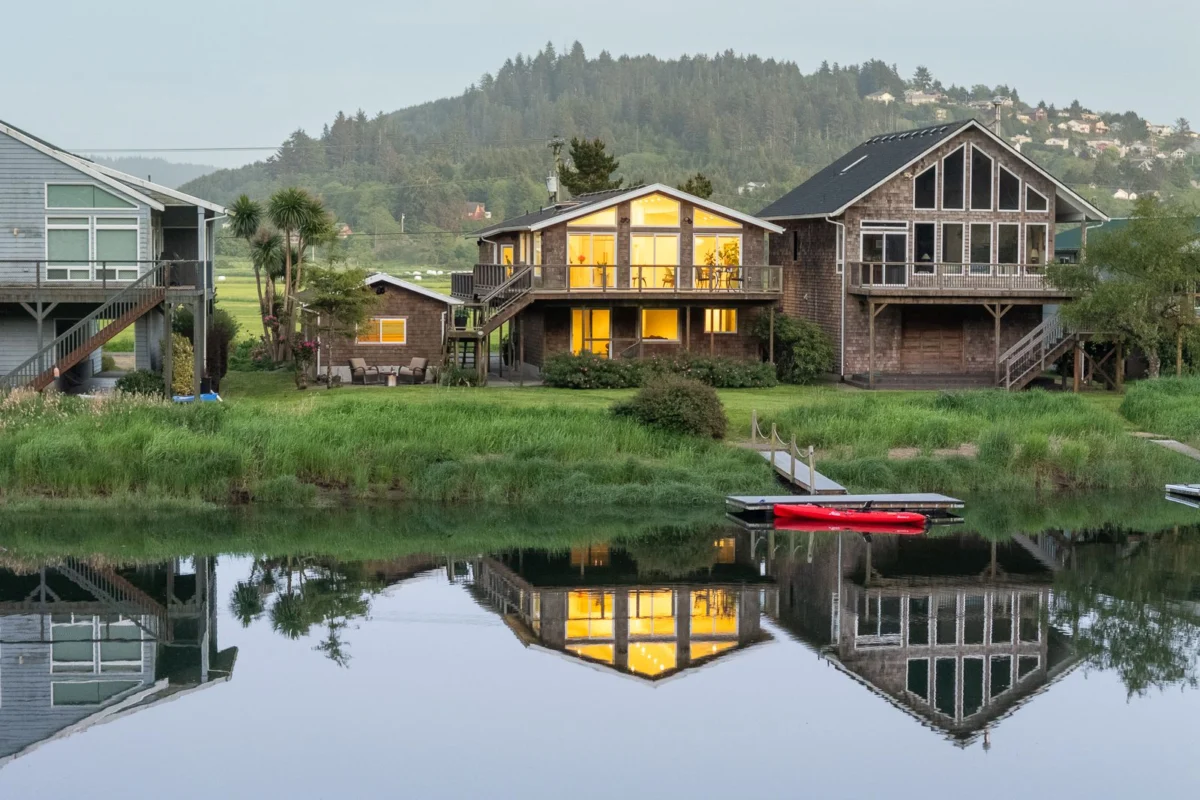 Workaday Design Transforms Pacific City Riverfront Home, Listed for $995,000, Offering Modern Luxury and Direct Nestucca River Access.